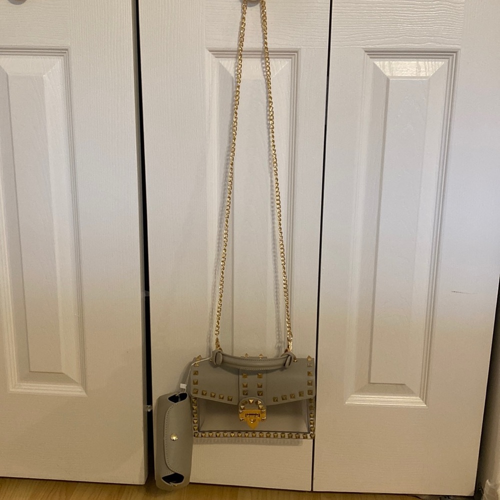 Gray Studded purse. Clear & has a separate pouch to put inside to conceal items